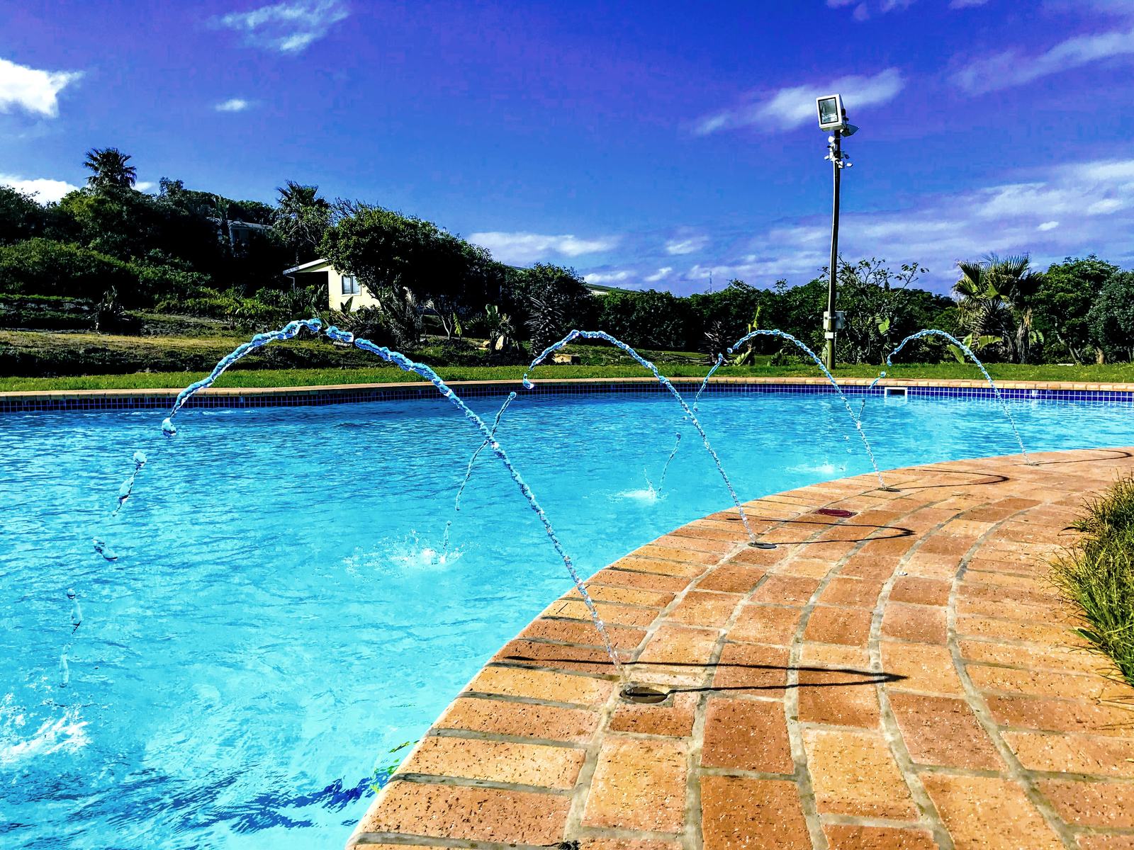 The 18-metre resort swimming pool with fountain jets at Yellow Sands